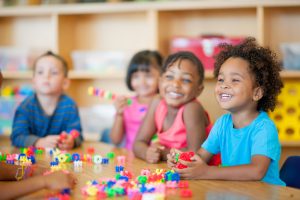 A diverse group of preschoolers in a classroom